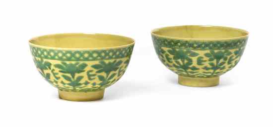 Appraisal: A Near-Pair of Chinese Yellow Glazed Dragon Bowls Qing Dynasty