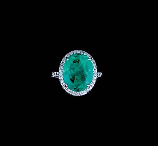 Appraisal: Columbian emerald and diamond ring oval emerald ct surrounded by