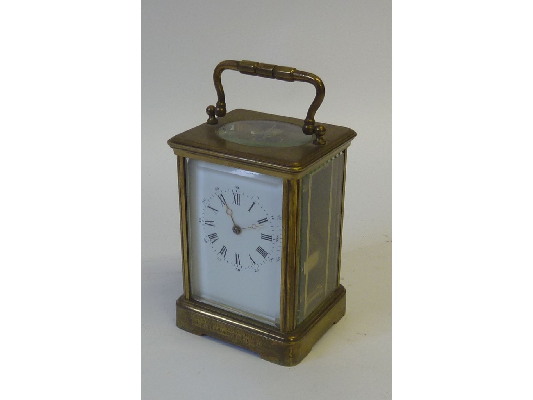 Appraisal: A LATE VICTORIAN CENTURY CARRIAGE CLOCK in brass and bevelled