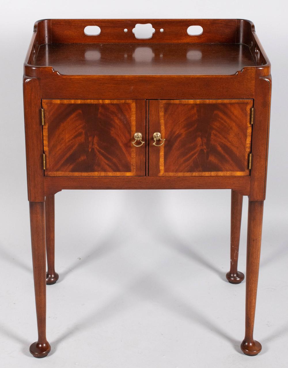 Appraisal: GEORGE III STYLE MAHOGANY BEDSIDE TABLE the rectangular three-quarter pierced