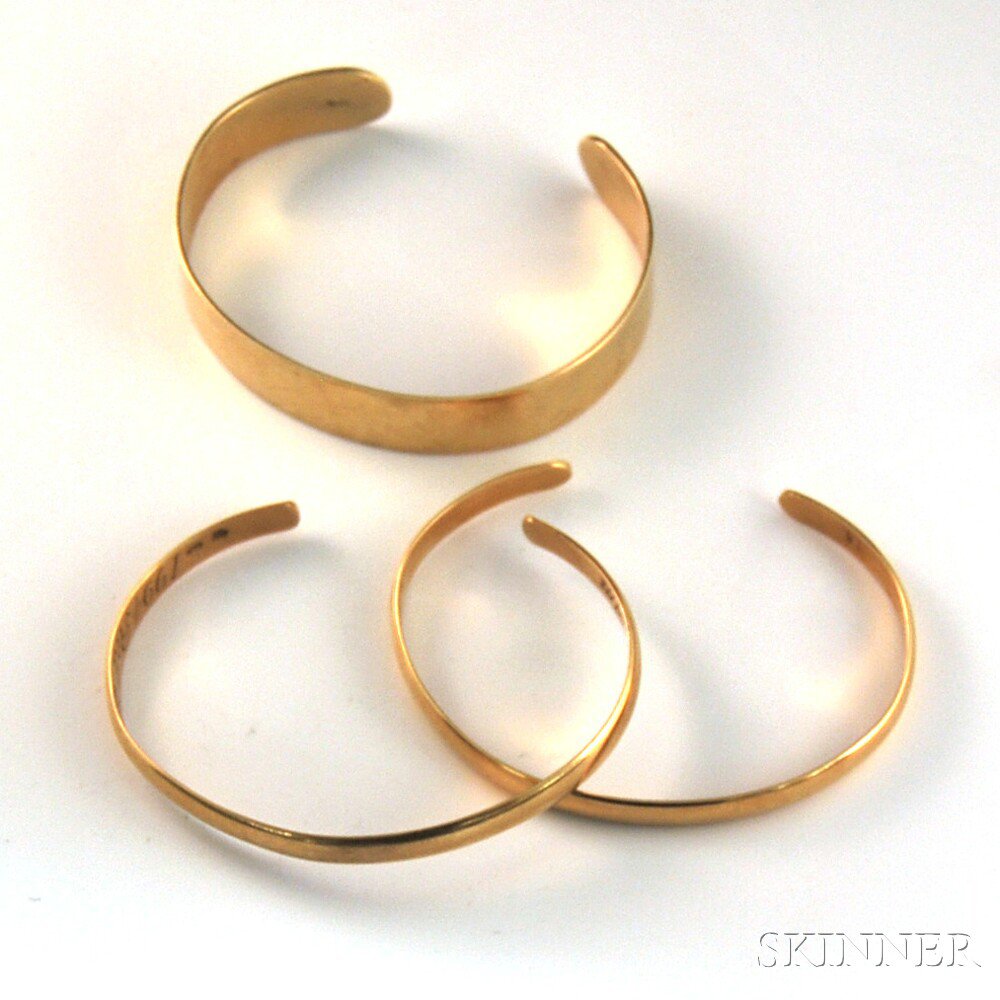 Appraisal: Three kt Gold Cuff Bracelets a pair of thin cuffs