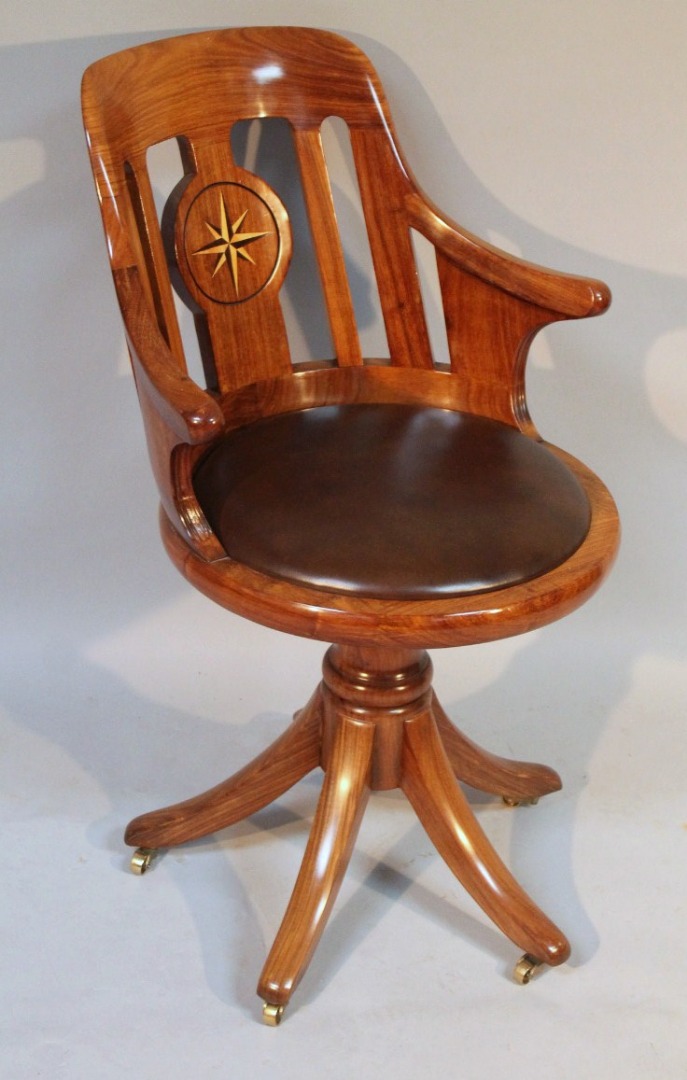 Appraisal: A Starbay African rosewood swivel office chair the plain shaped