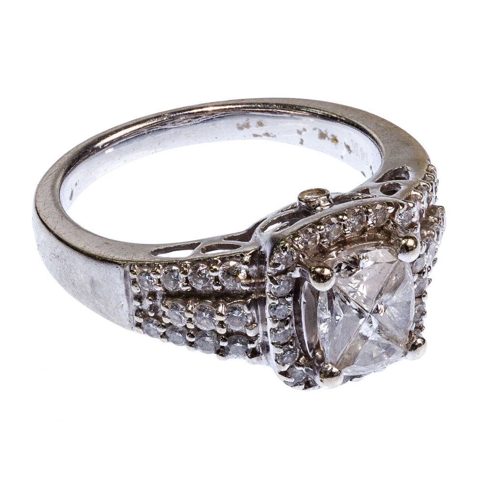 Appraisal: K WHITE GOLD AND DIAMOND RINGHaving trillion cut diamonds weighing