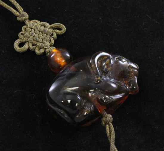 Appraisal: A Chinese amber 'ram' pendant late th early th century