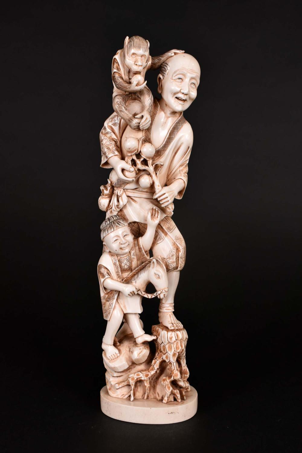 Appraisal: JAPANESE OKIMONO OF A FATHER SON WITH A MONKEYMeiji period