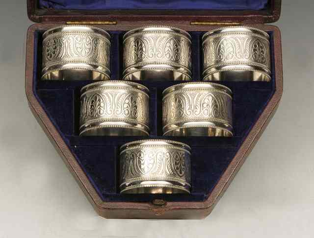 Appraisal: A CASED SET OF SIX SILVER PLATED NAPKIN RINGS with