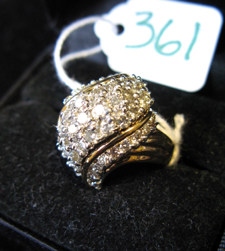 Appraisal: DIAMOND AND FOURTEEN KARAT GOLD CLUSTER RING set with round-cut