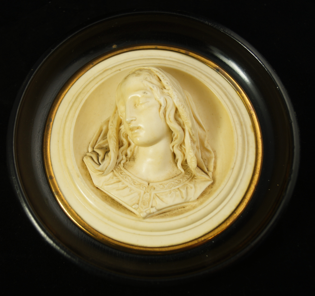 Appraisal: A thC Continental circular alabaster plaque carved in high relief