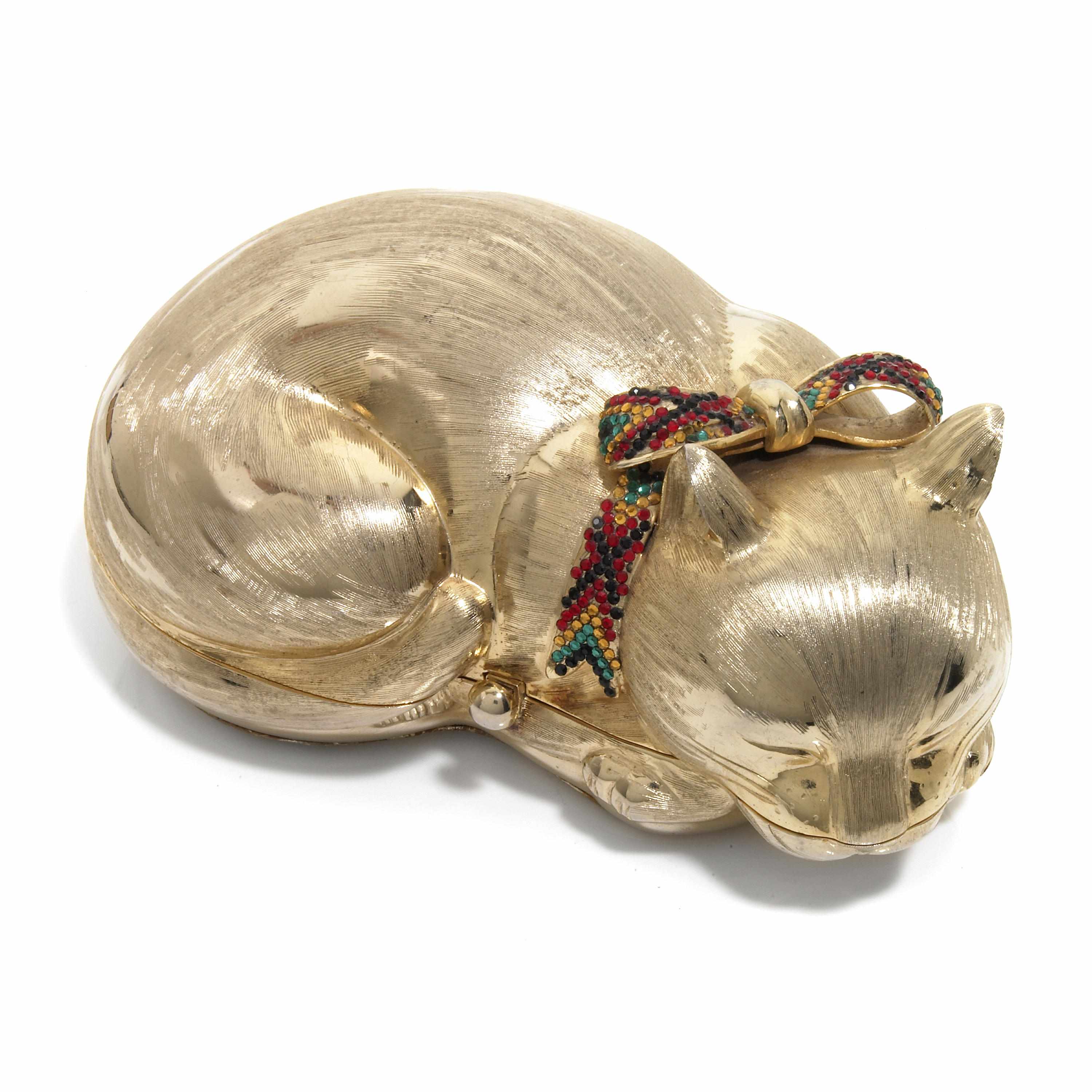 Appraisal: A gold colored metal sleeping cat purse with a crystal