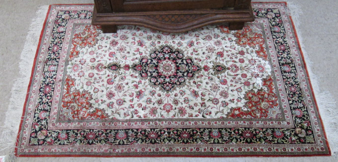 Appraisal: HAND KNOTTED PERSIAN SILK AREA RUG floral and central floral