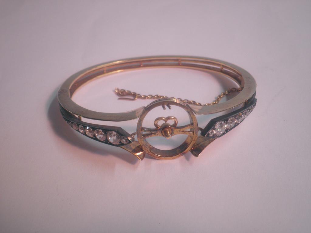 Appraisal: A Victorian hinged bangle set with graduated round old brilliant