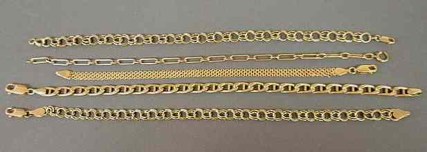 Appraisal: Five k yellow gold bracelets in various link styles dwt