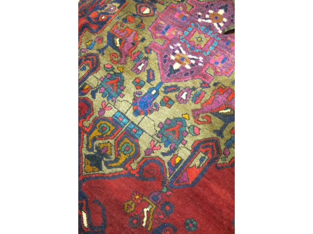 Appraisal: An Iranian multicoloured floor rug with geometric design cm long