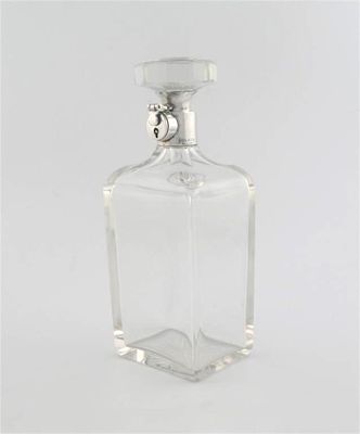 Appraisal: A modern silver mounted cut-glass lockable decanter by Hukin Heath