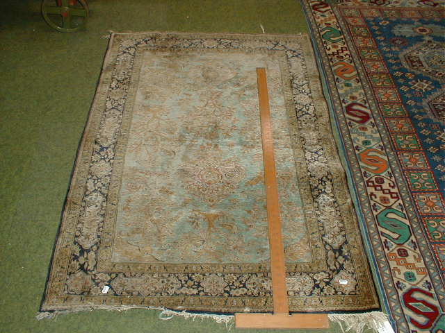 Appraisal: A blue ground Persian design rug