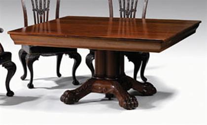 Appraisal: Carved mahogany pedestal dining table The rectangular top opening to