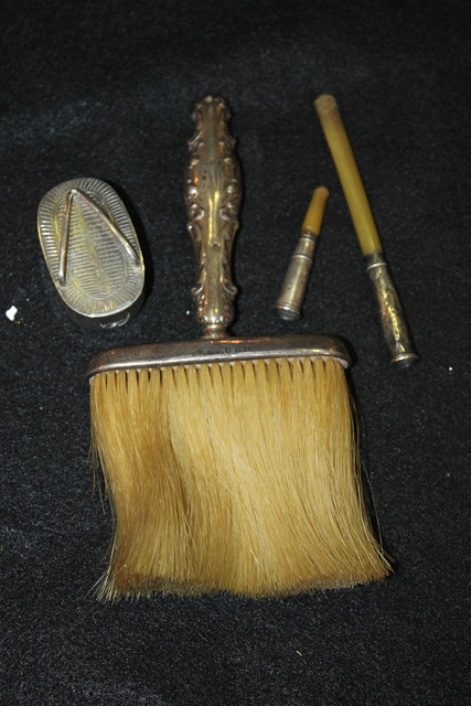 Appraisal: A STERLING SILVER BRUSH together with two silver cigarette holders