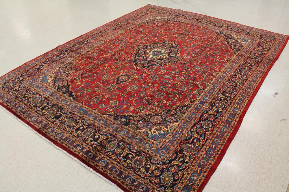 Appraisal: VINTAGE HAND KNOTTED PERSIAN CARPET floral and central floral medallion