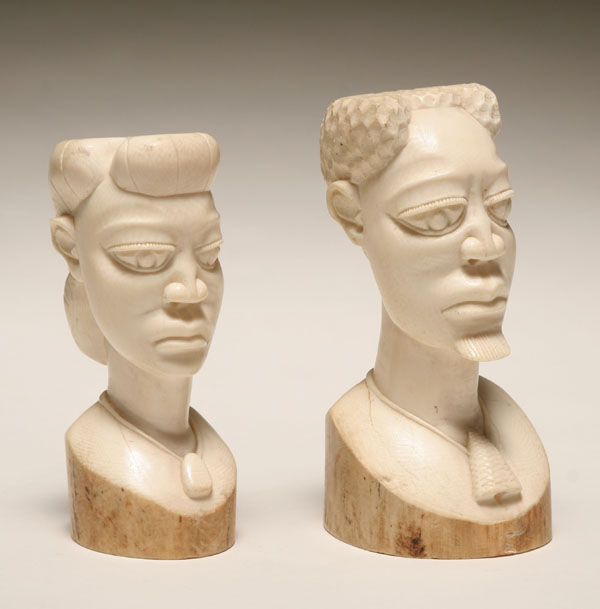 Appraisal: Pair vintage carved ivory African male and female busts The