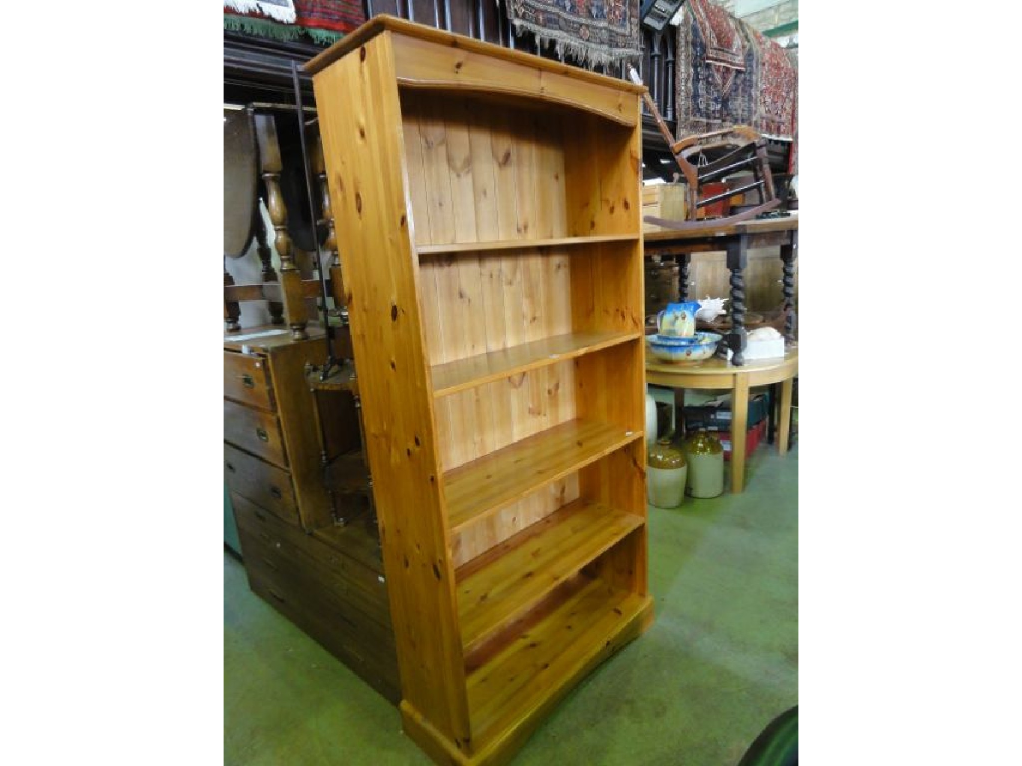 Appraisal: A contemporary stripped pine freestanding open bookcase with four adjustable