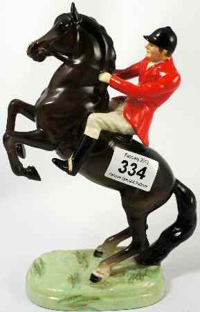 Appraisal: Beswick Huntsman on rearing horse chipped ears and legs restuck