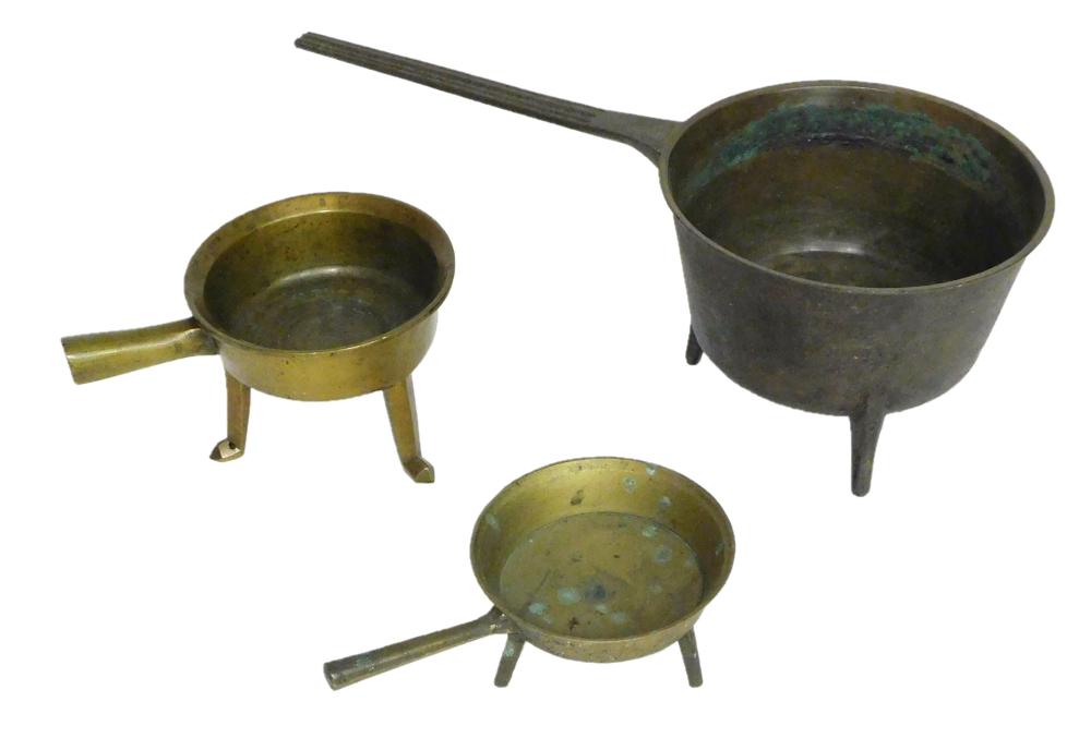 Appraisal: Three cooking pots th th C graduated in size brass