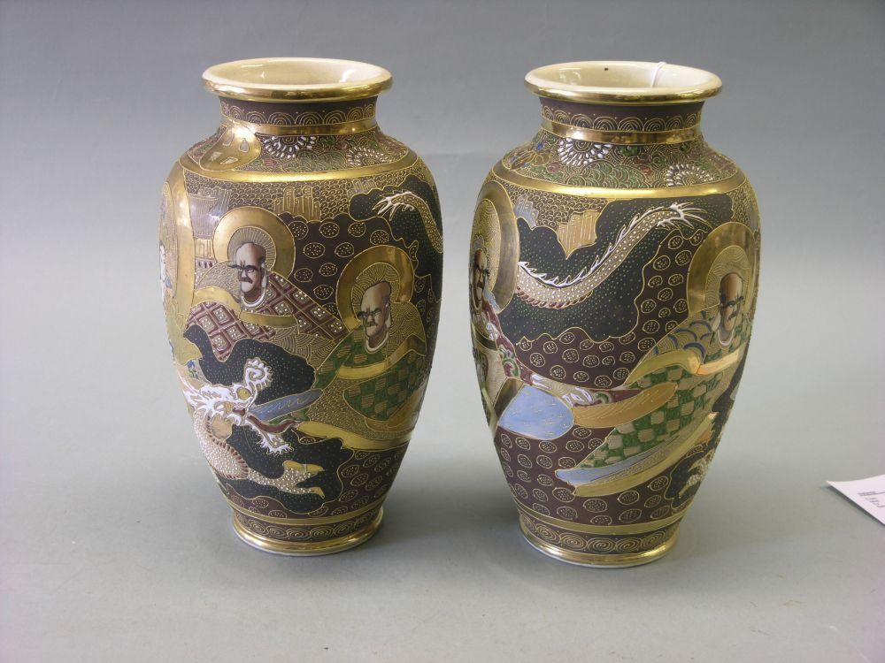 Appraisal: A pair of Satsuma vases ovoid shape brocaded with figures