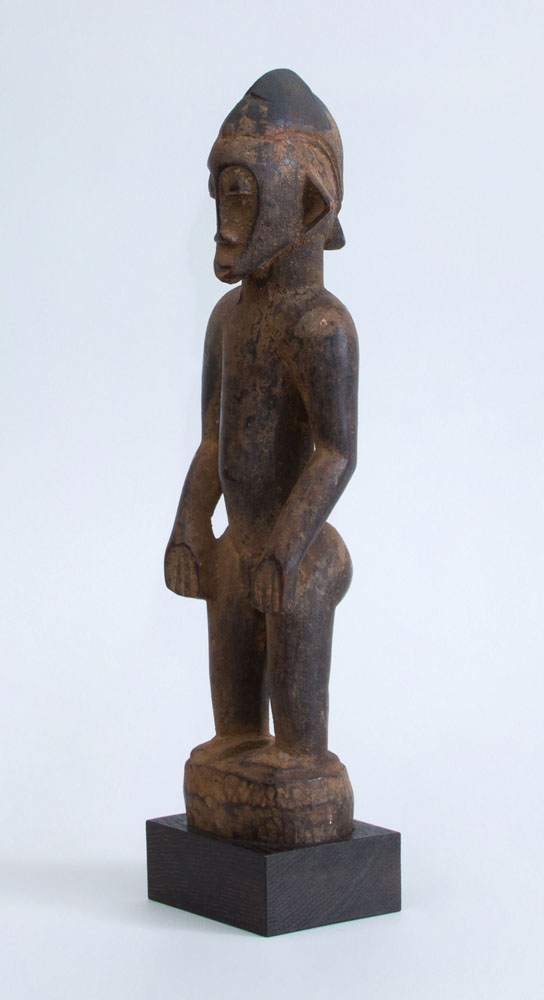 Appraisal: AFRICAN CARVED HARDWOOD MALE FIGURE SENUFO Now mounted on a