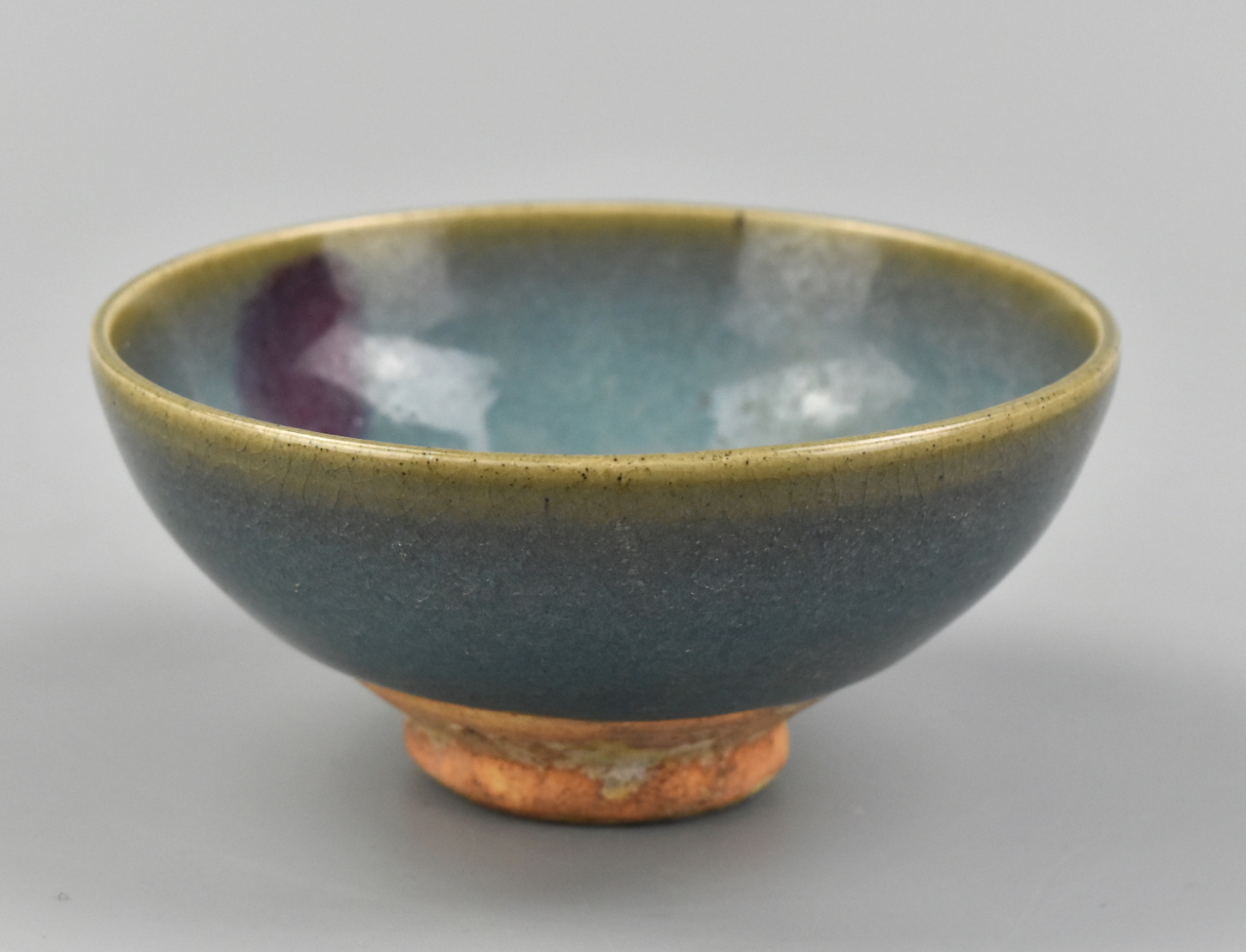 Appraisal: A Chinese jun ware bowl with red interior splash Blue-green