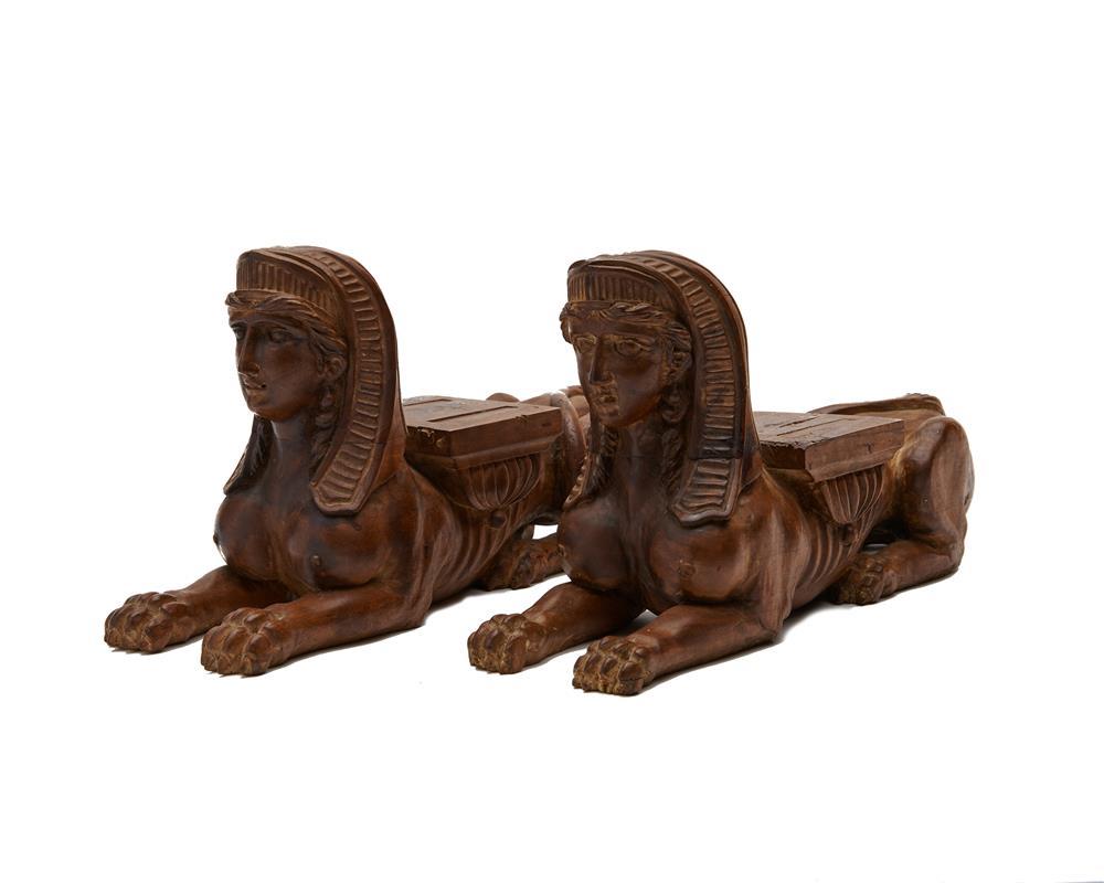 Appraisal: Pair of Carved Fruitwood Recumbent Greek Sphinx Figures length in