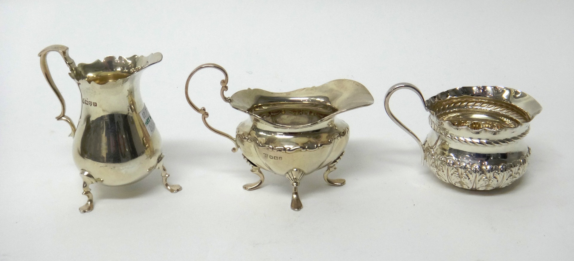 Appraisal: Silver comprising a Victorian cream jug with embossed decoration beneath