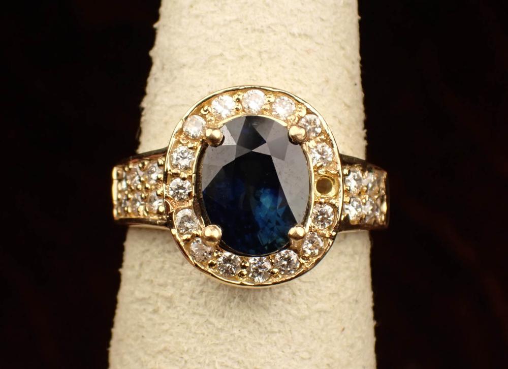 Appraisal: SAPPHIRE DIAMOND AND FOURTEEN KARAT GOLD RING The yellow gold