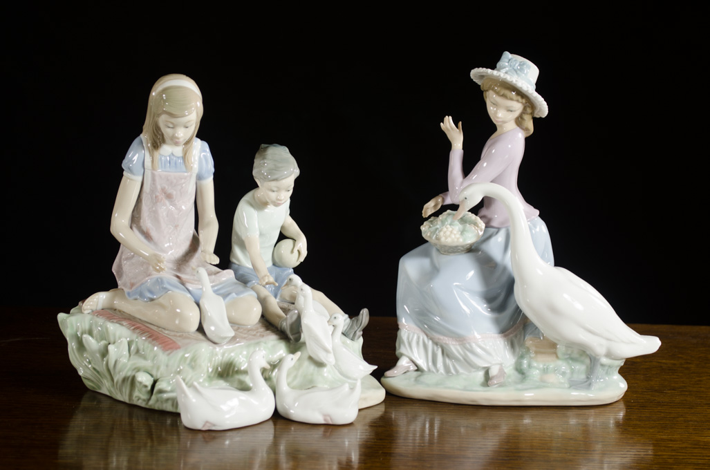 Appraisal: TWO LLADRO PORCELAIN FIGURAL GROUPS by sculptor Vincente Martinez Playing