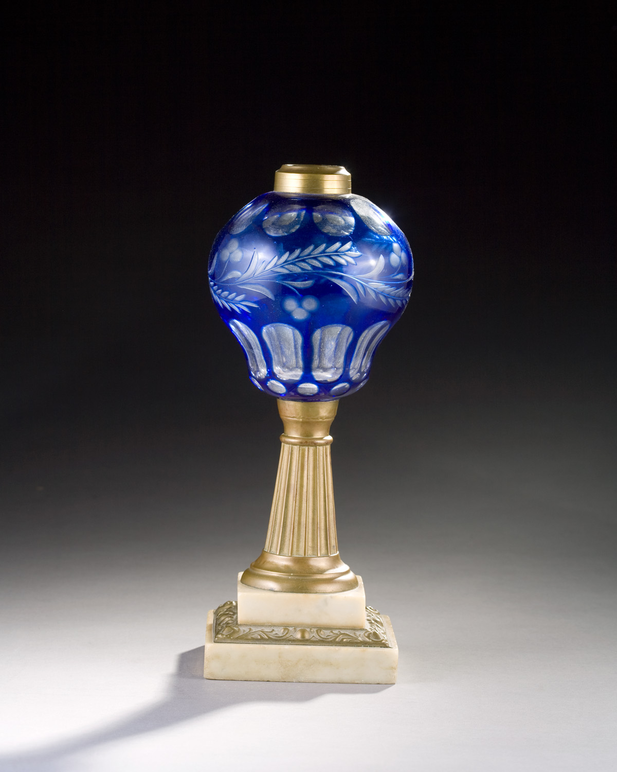 Appraisal: AMERICAN CUT AND ENGRAVED BLUE OVERLAY LAMP BOSTON SANDWICH GLASS