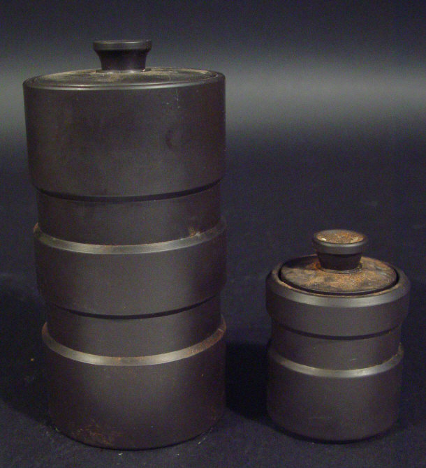 Appraisal: Two Wedgwood black basalt turned cylindrical pots and covers each