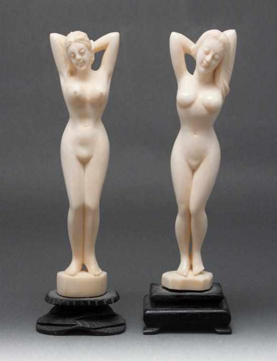 Appraisal: Two Chinese carved ivory female nude figures mounted on wood