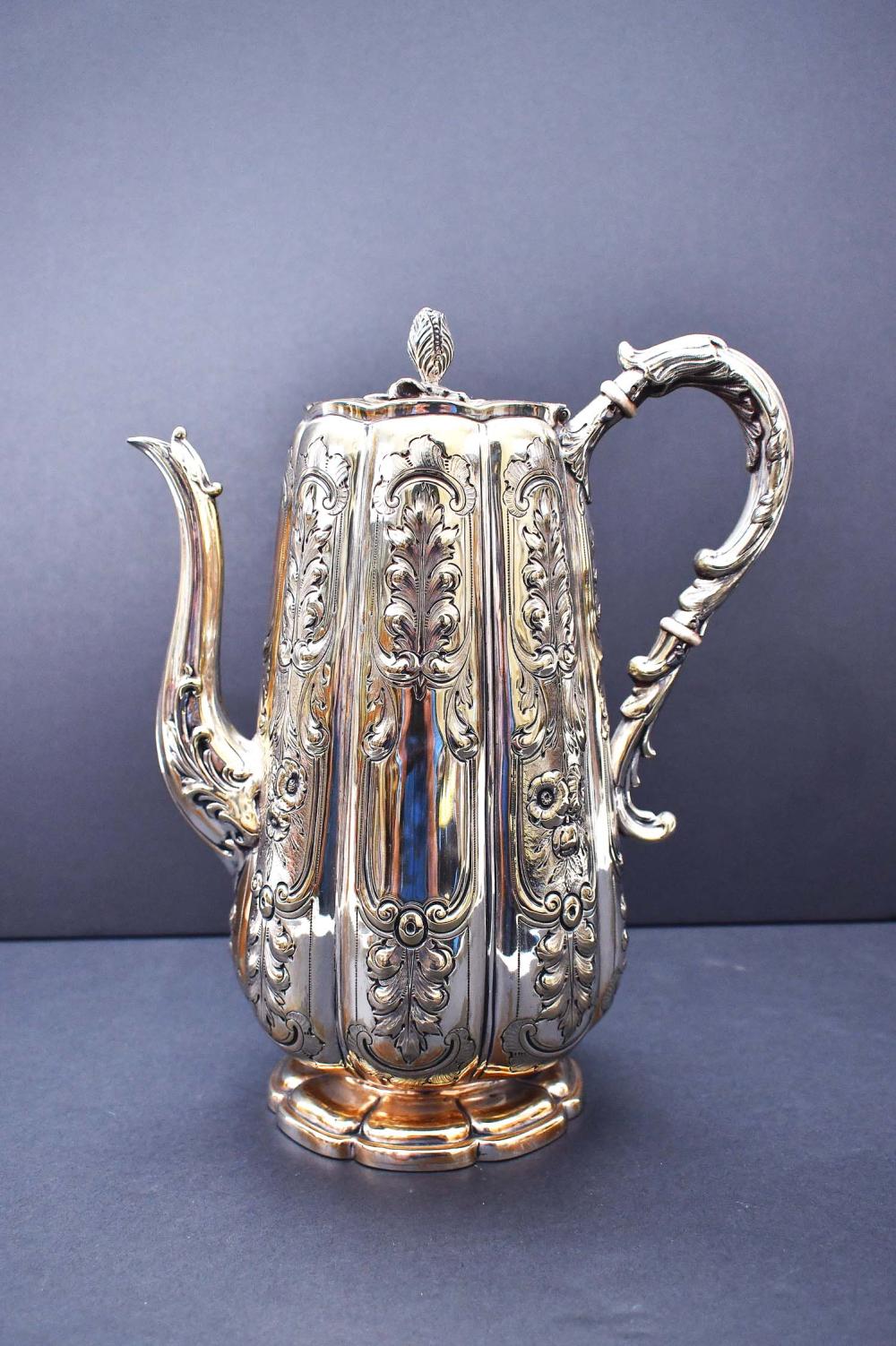 Appraisal: ENGLISH SILVER PLATE COFFEE POTIn a rococo style with repousse