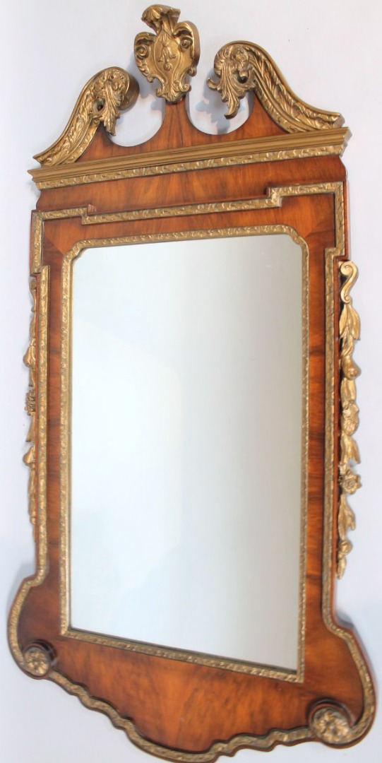 Appraisal: A George III style walnut and parcel gilt pier glass