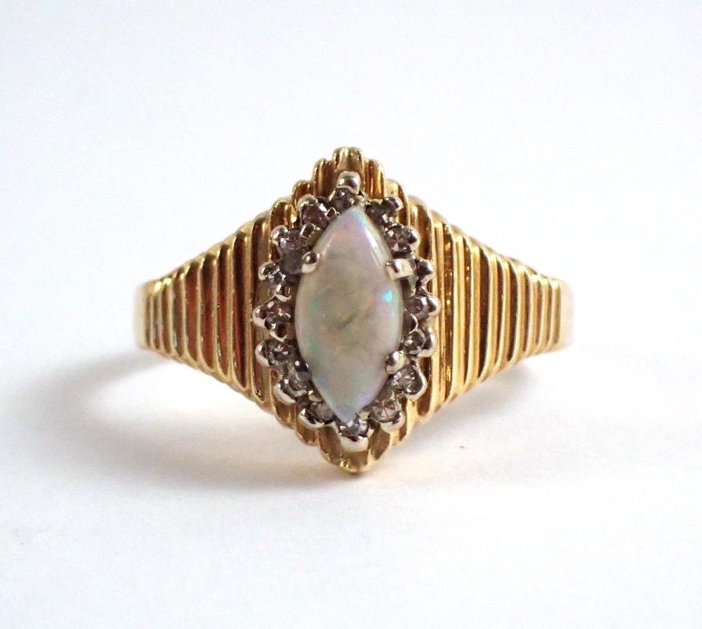 Appraisal: OPAL DIAMOND AND FOURTEEN KARAT GOLD RING The k yellow