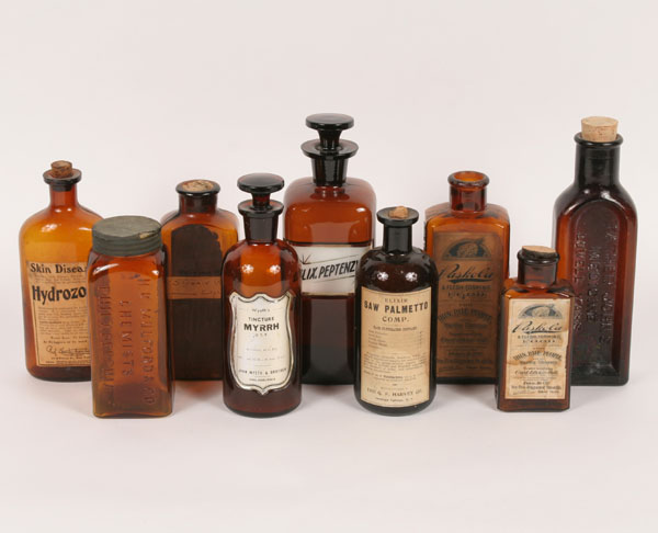 Appraisal: Nine amber glass medicine bottles and apothecary jars Includes two