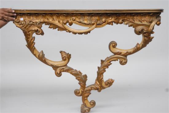 Appraisal: ITALIAN GILTWOOD HANGING CONSOLE Serpentine rococo style in cream paint