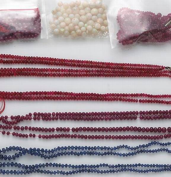 Appraisal: A collection of stone beads including rubies sapphires spinel and