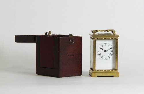 Appraisal: A gilt brass carriage clock with fluted columns and ribbed