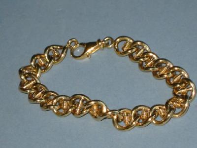 Appraisal: A CT GOLD BRACELET with fancy links long gms