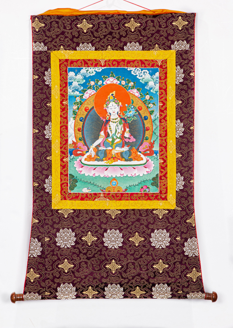 Appraisal: TIBETAN THANGKA Tibetan thangka mounted in silk brocade h x