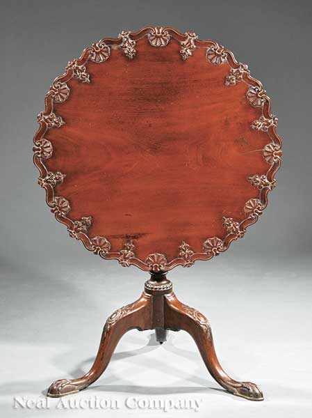 Appraisal: An English or Irish Carved Mahogany Tilt-Top Tea Table late