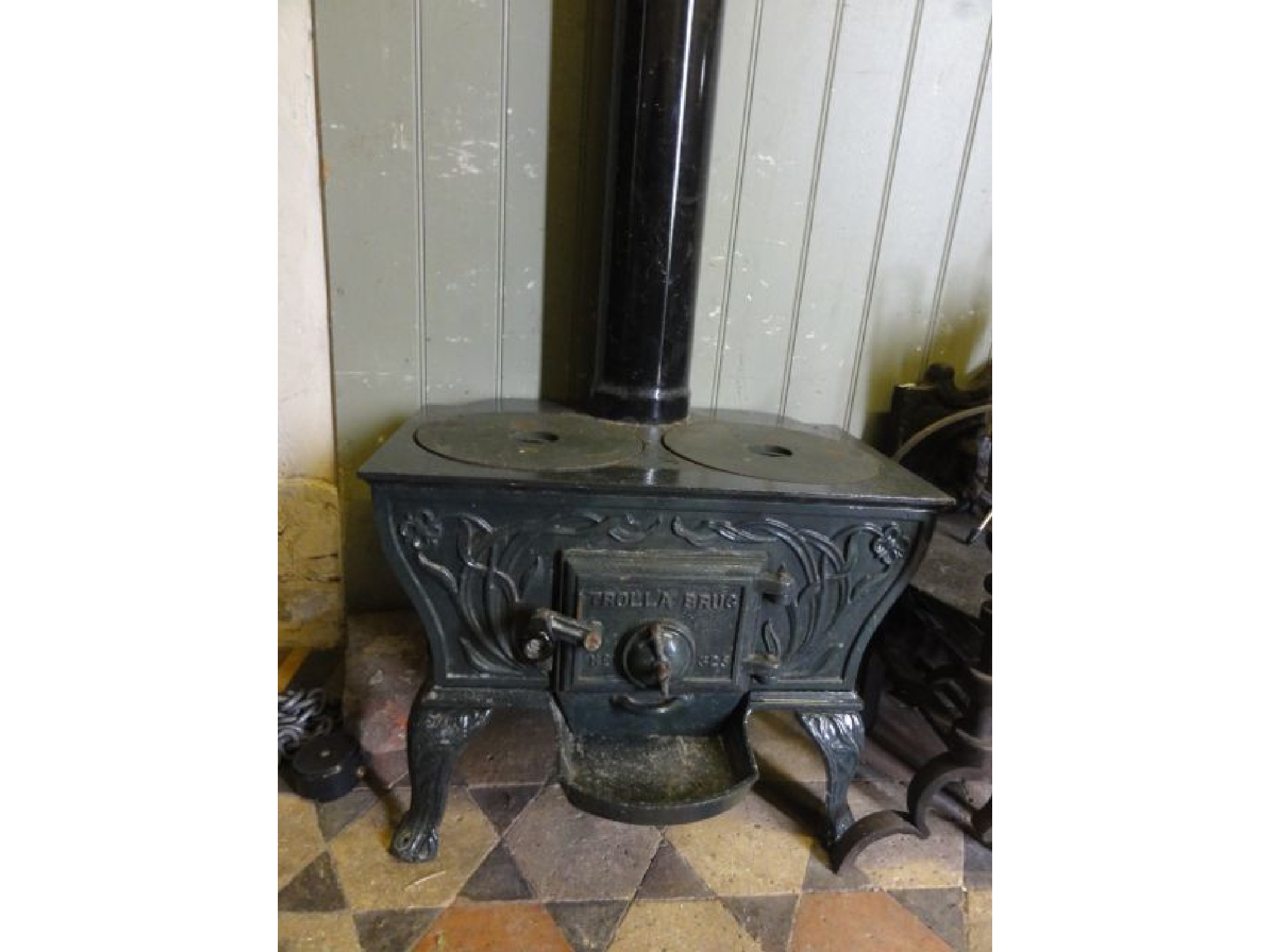 Appraisal: A Trolla Brug cast iron wood burning stove with shaped