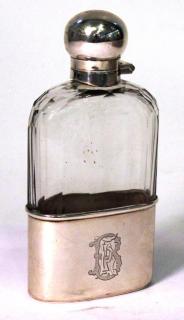 Appraisal: Victorian Sterling Glass Spirits Flask The cut and faceted rectangular