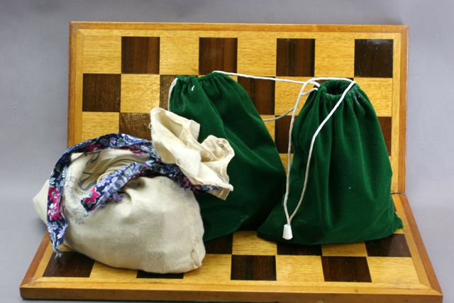 Appraisal: A chess set and board the pieces by Staunton together