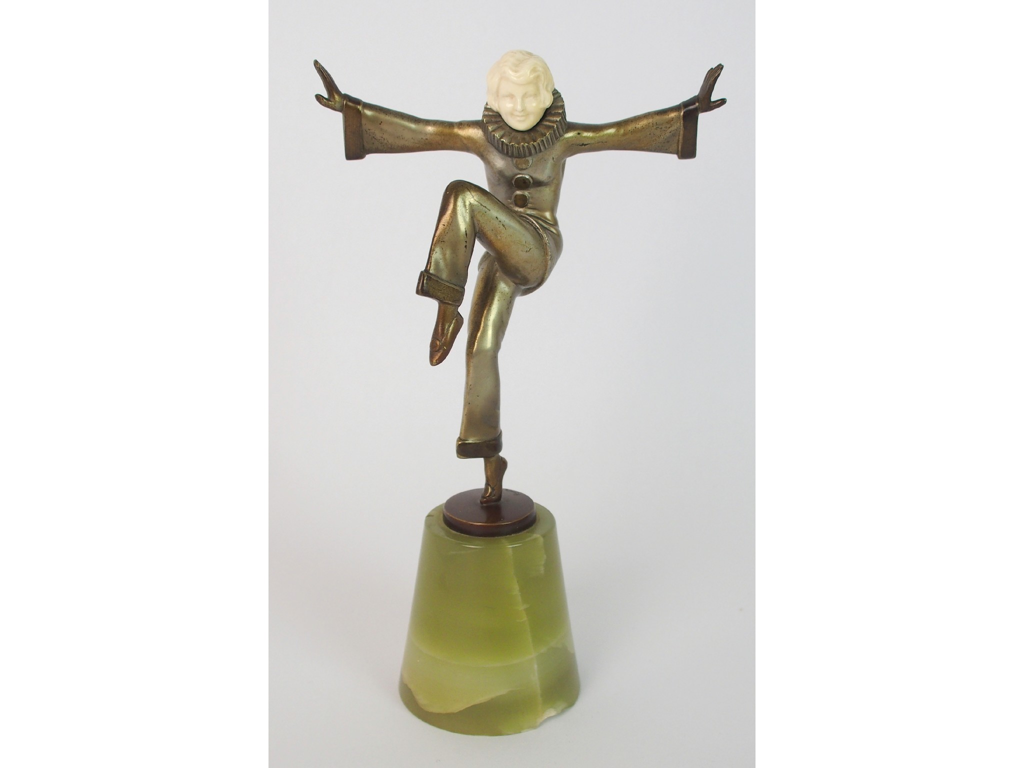 Appraisal: A Lorenzl ivory and bronze Art Deco figure Pierrettethe figure